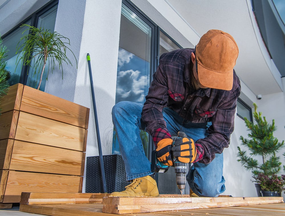 Man working on site with drill